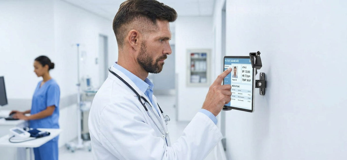 Doctor using a tablet in a wall-mounted security enclosure